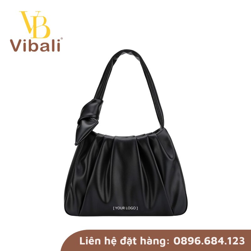 Gợi ý mẫu túi xách da in logo quà tặng công ty 8/3 ý nghĩa, thiết thực Tui deo vai gap nep that nut chan quai